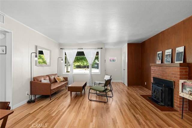 886 Lynn Ln, Chico, CA 95926 - living area featuring ornamental molding, light wood finished floors, and wooden walls