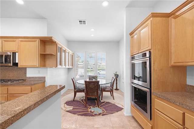 44397 Mesquite Dr, Indian Wells, CA 92210 - kitchen featuring appliances with stainless steel finishes, light brown cabinets, recessed lighting, and light tile patterned flooring
