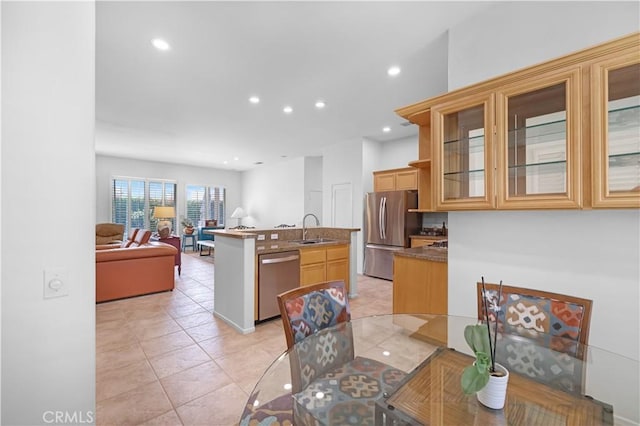 44397 Mesquite Dr, Indian Wells, CA 92210 - kitchen featuring stainless steel appliances, open floor plan, a kitchen island with sink, light tile patterned floors, and recessed lighting