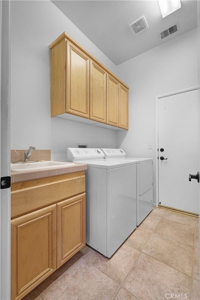 44397 Mesquite Dr, Indian Wells, CA 92210 - laundry room with cabinet space, separate washer and dryer, and light tile patterned floors
