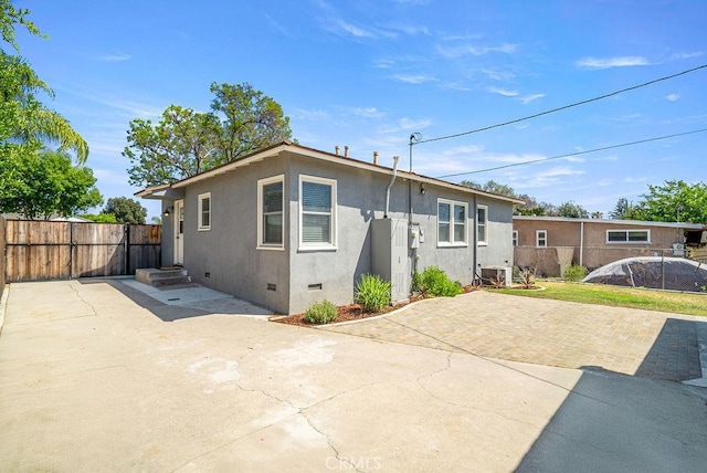 8213 Strub Ave, Whittier, CA 90602 - rear view of property featuring crawl space, a patio, and stucco siding
