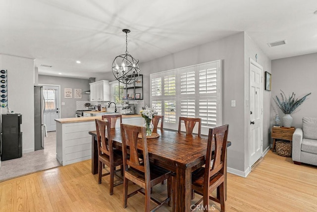 8213 Strub Ave, Whittier, CA 90602 - dining area featuring light wood-type flooring, a chandelier, and recessed lighting