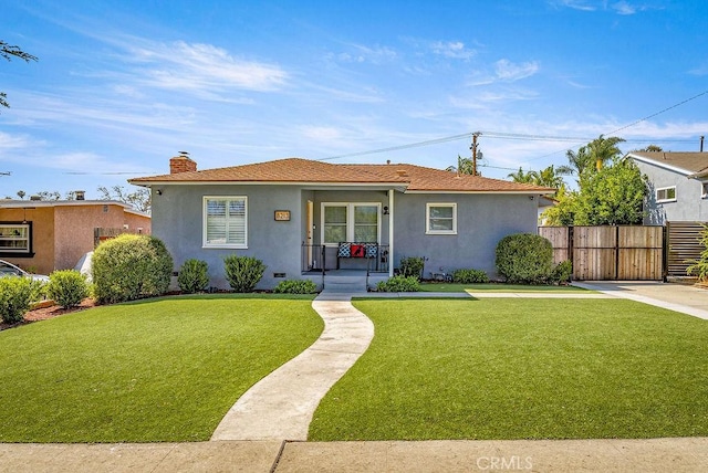 8213 Strub Ave, Whittier, CA 90602 - view of front of house featuring a porch, stucco siding, and a chimney