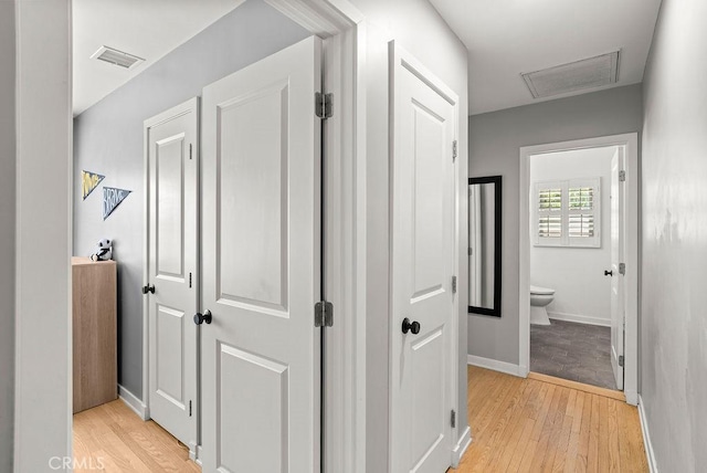 8213 Strub Ave, Whittier, CA 90602 - hallway featuring light wood finished floors and attic access