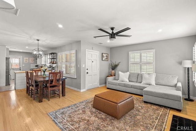 8213 Strub Ave, Whittier, CA 90602 - living area with recessed lighting, ceiling fan, light wood-type flooring, and a chandelier