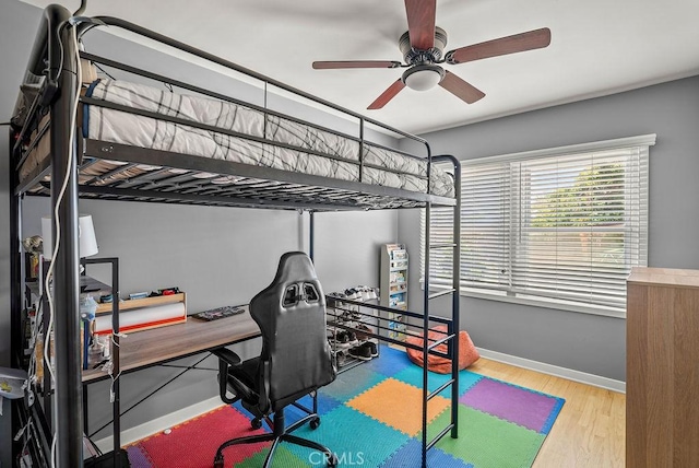 8213 Strub Ave, Whittier, CA 90602 - bedroom with wood finished floors, an office area, and a ceiling fan