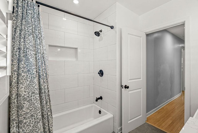 8213 Strub Ave, Whittier, CA 90602 - full bathroom featuring shower / bath combo with shower curtain and baseboards