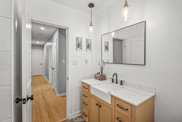 8213 Strub Ave, Whittier, CA 90602 - bathroom with vanity and wood finished floors