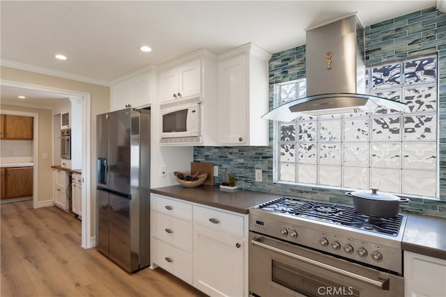 3666 Greve Dr, Rancho Palos Verdes, CA 90275 - kitchen featuring stainless steel appliances, wall chimney range hood, backsplash, white cabinets, and light wood finished floors