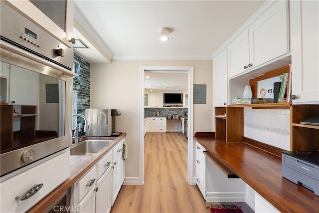 3666 Greve Dr, Rancho Palos Verdes, CA 90275 - kitchen with open shelves, backsplash, white cabinetry, ornamental molding, and wooden counters