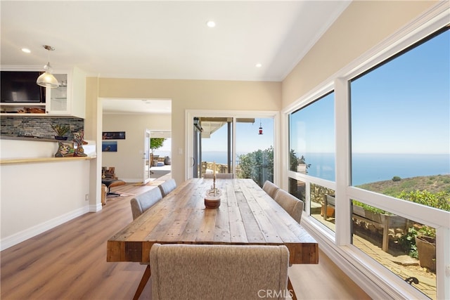 3666 Greve Dr, Rancho Palos Verdes, CA 90275 - dining area with wood finished floors, a water view, recessed lighting, and ornamental molding