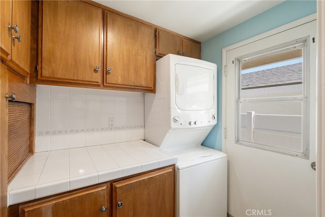 3666 Greve Dr, Rancho Palos Verdes, CA 90275 - laundry room with stacked washer and clothes dryer and cabinet space