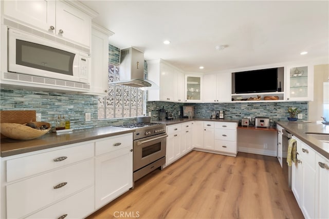 3666 Greve Dr, Rancho Palos Verdes, CA 90275 - kitchen with appliances with stainless steel finishes, wall chimney range hood, tasteful backsplash, dark countertops, and recessed lighting