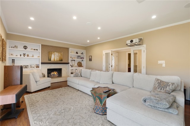 3666 Greve Dr, Rancho Palos Verdes, CA 90275 - living area with wood finished floors, ornamental molding, recessed lighting, built in features, and a lit fireplace