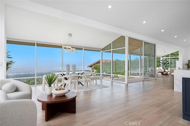 952 Via Del Monte, Palos Verdes Estates, CA 90274 - living room with expansive windows, wood finished floors, a chandelier, and recessed lighting