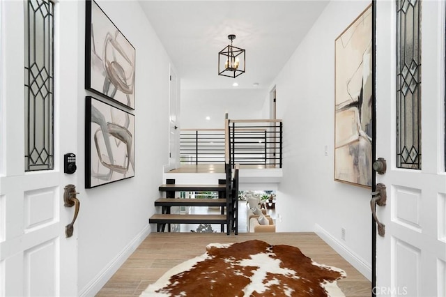952 Via Del Monte, Palos Verdes Estates, CA 90274 - foyer with stairs, light wood-style floors, and a chandelier