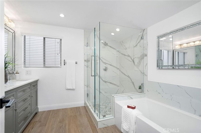 952 Via Del Monte, Palos Verdes Estates, CA 90274 - bathroom featuring a bath, vanity, a marble finish shower, recessed lighting, and wood finished floors