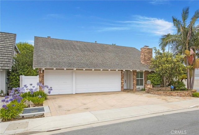 9552 Castine Dr, Huntington Beach, CA 92646 - view of front of home with a garage, concrete driveway, a shingled roof, and a chimney