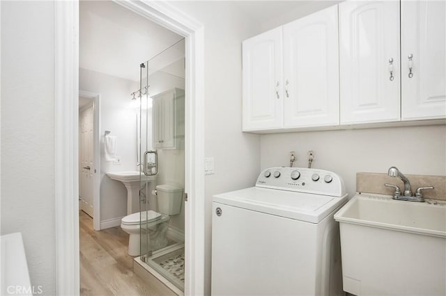 9552 Castine Dr, Huntington Beach, CA 92646 - laundry area with washer / clothes dryer and light wood-style flooring