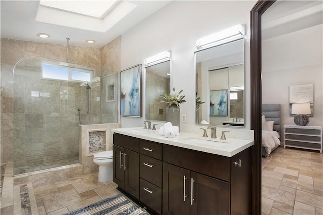 9552 Castine Dr, Huntington Beach, CA 92646 - full bathroom with double vanity, a tile shower, stone tile floors, and ensuite bathroom