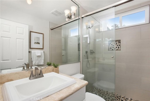 9552 Castine Dr, Huntington Beach, CA 92646 - full bathroom featuring healthy amount of natural light, a stall shower, and vanity