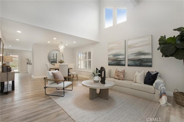 9552 Castine Dr, Huntington Beach, CA 92646 - living area with plenty of natural light, light wood-type flooring, and recessed lighting