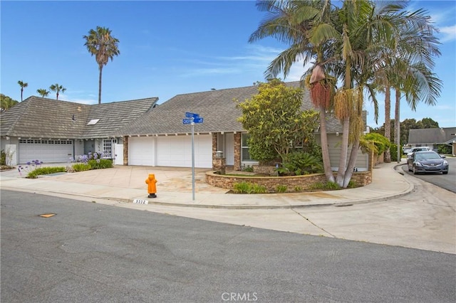 9552 Castine Dr, Huntington Beach, CA 92646 - view of front of property with a garage and driveway