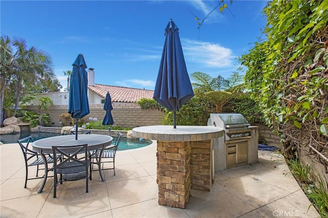 9552 Castine Dr, Huntington Beach, CA 92646 - fenced backyard with area for grilling, a patio area, and outdoor dining area