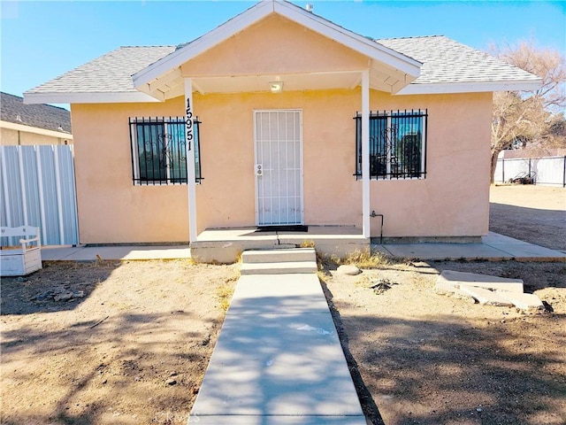 15951 M St, Mojave, CA 93501 - bungalow with stucco siding and roof with shingles