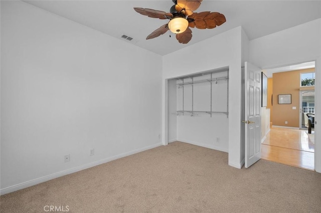 18051 Joyful Ln Unit 201, Huntington Beach, CA 92648 - unfurnished bedroom featuring carpet, a closet, and a ceiling fan