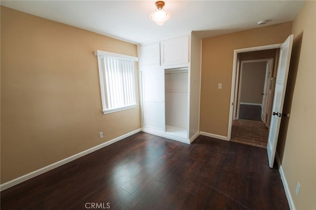 902 E Francis Ave, La Habra, CA 90631 - unfurnished bedroom featuring dark wood-type flooring and a closet