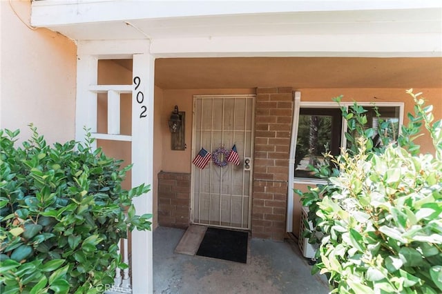 902 E Francis Ave, La Habra, CA 90631 - doorway to property with brick siding and stucco siding