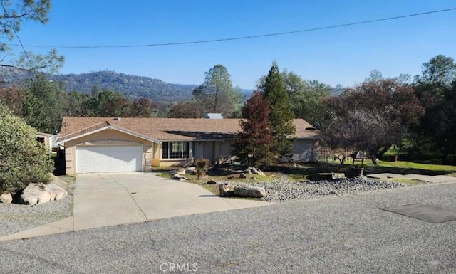 42445 Deep Forest Dr, Coarsegold, CA 93614 - ranch-style home with driveway and a garage