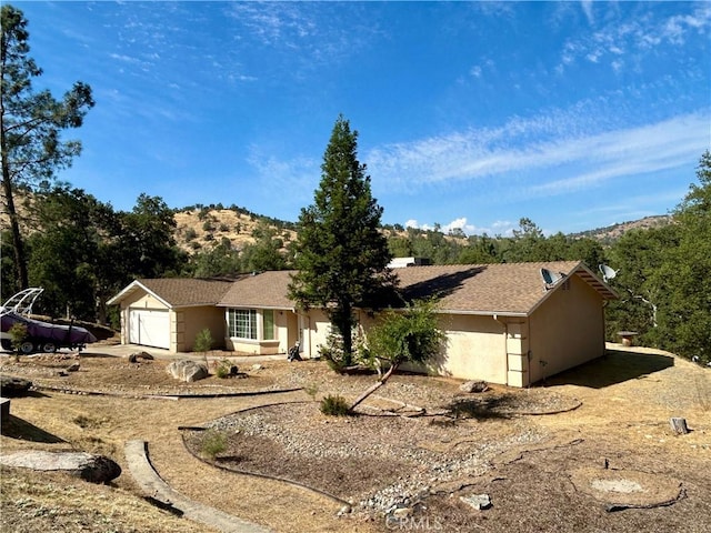 42445 Deep Forest Dr, Coarsegold, CA 93614 - single story home featuring an attached garage and stucco siding