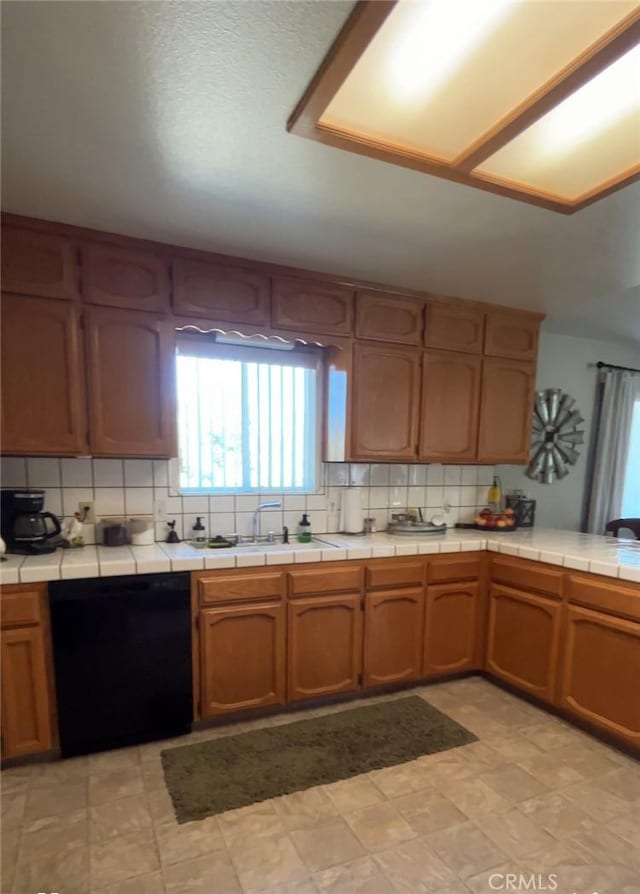 42445 Deep Forest Dr, Coarsegold, CA 93614 - kitchen featuring black dishwasher, tasteful backsplash, and tile countertops