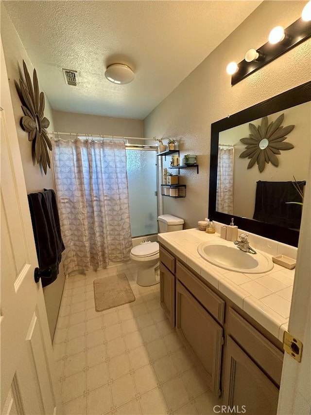 42445 Deep Forest Dr, Coarsegold, CA 93614 - full bath with tile patterned floors, vanity, a textured ceiling, and shower / tub combo with curtain