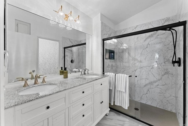 340 Isthmus Way Unit 56, Oceanside, CA 92058 - full bathroom with a marble finish shower, double vanity, marble look tile flooring, and lofted ceiling