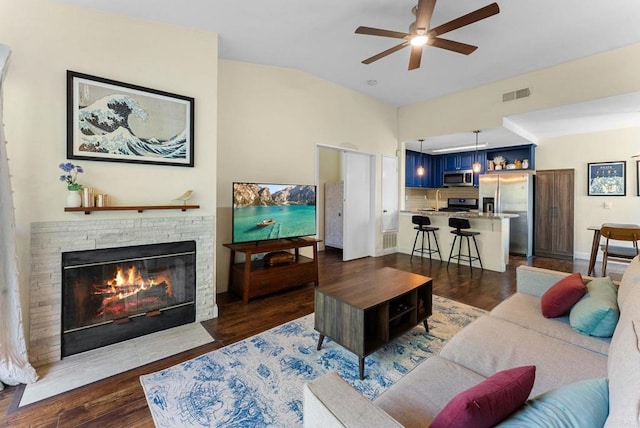 340 Isthmus Way Unit 56, Oceanside, CA 92058 - living area featuring ceiling fan, a brick fireplace, and dark wood-type flooring