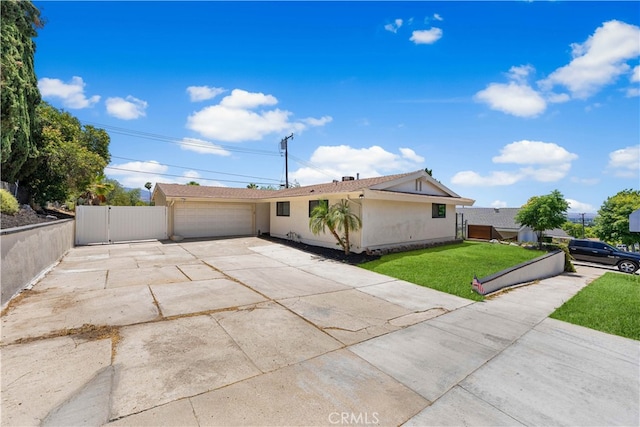 18718 Delight St, Canyon Country, CA 91351 - view of front of home with concrete driveway, an attached garage, and stucco siding