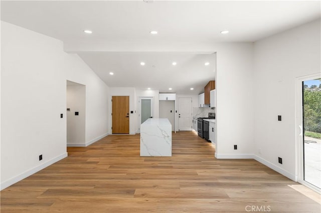 18718 Delight St, Canyon Country, CA 91351 - kitchen featuring electric stove, recessed lighting, light wood-type flooring, white cabinets, and light stone countertops