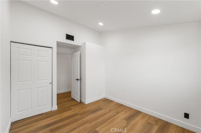 18718 Delight St, Canyon Country, CA 91351 - unfurnished bedroom with recessed lighting, light wood-type flooring, and a closet