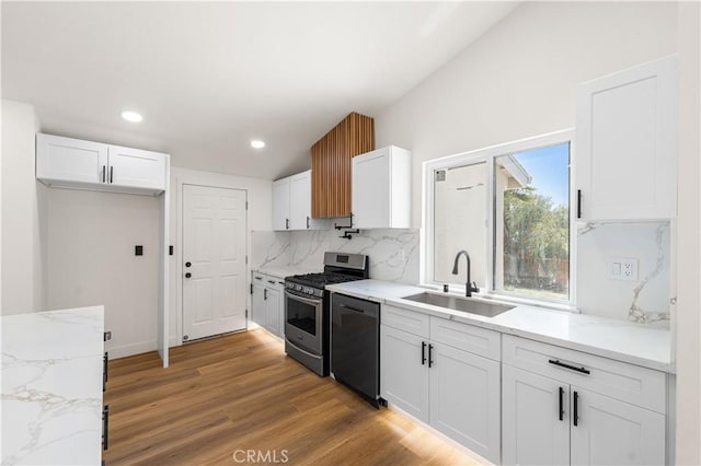 18718 Delight St, Canyon Country, CA 91351 - kitchen featuring stainless steel gas range oven, dishwasher, white cabinets, tasteful backsplash, and recessed lighting