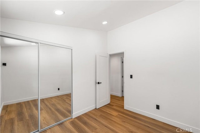18718 Delight St, Canyon Country, CA 91351 - unfurnished bedroom featuring wood finished floors, a closet, and recessed lighting