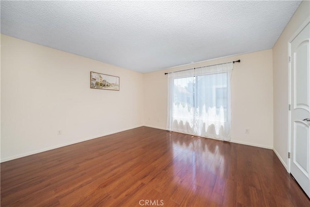 18100 Burbank Blvd Unit 11, Tarzana, CA 91356 - empty room with wood finished floors and a textured ceiling