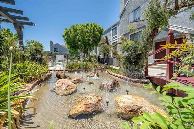 18100 Burbank Blvd Unit 11, Tarzana, CA 91356 - view of home's community featuring a small pond