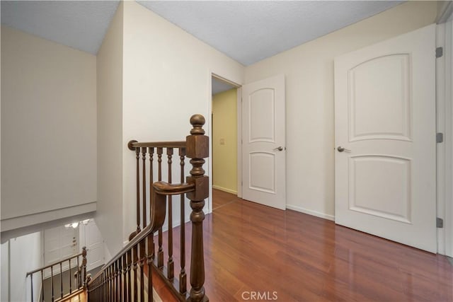 18100 Burbank Blvd Unit 11, Tarzana, CA 91356 - corridor with an upstairs landing and wood finished floors