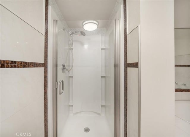 18100 Burbank Blvd Unit 11, Tarzana, CA 91356 - full bathroom with a stall shower and tile walls