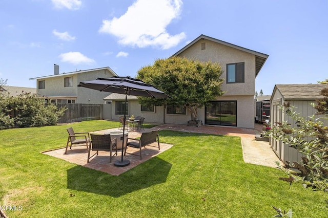 3051 Ketch Pl, Oxnard, CA 93035 - back of house with a patio, stucco siding, and a storage unit