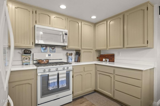 3051 Ketch Pl, Oxnard, CA 93035 - kitchen with white appliances, light countertops, recessed lighting, and cream cabinets