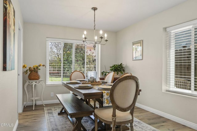 3051 Ketch Pl, Oxnard, CA 93035 - dining space featuring a chandelier and wood finished floors